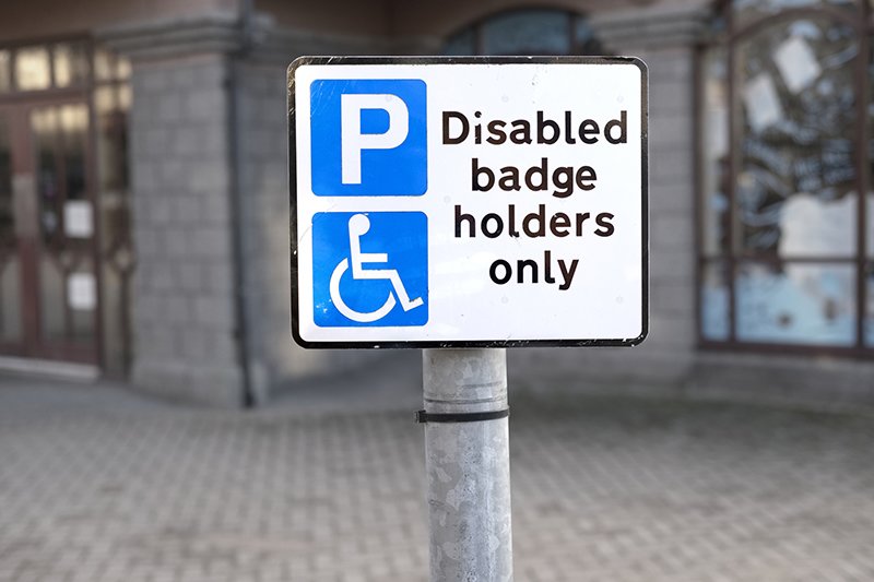 A sign showing for a parking bay that is reserved for holders of disabled badges only.