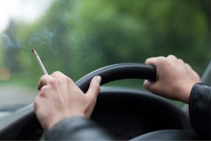 Smoking while driving could cost drivers around £2,000 when they come to sell their car