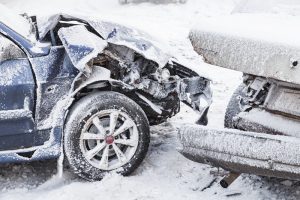 Collision of two cars in snow.