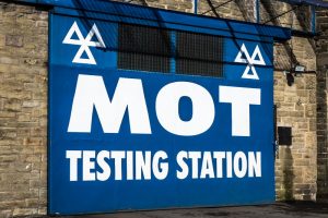 Large sign of an MOT testing station in the UK