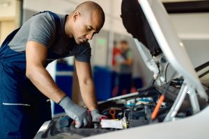 Mechanic working on a car engine