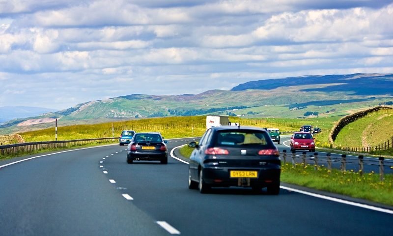 Cars on a dual carriageway country road over the hills