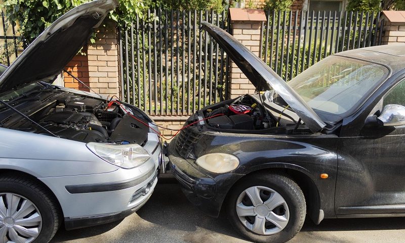 Recharging a car battery from a car