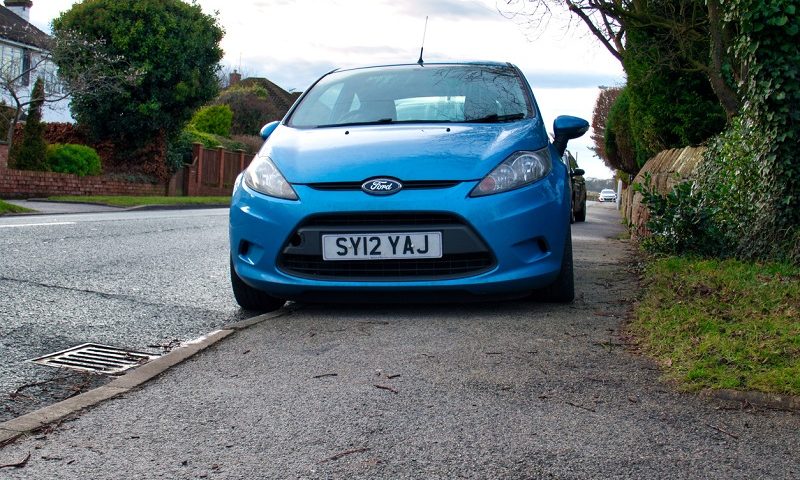 A car parked on the pavement