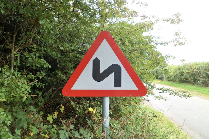 Double-bend road sign in the UK