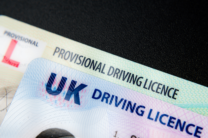 Image of a full UK driving licence overlapping a provisional UK driving licence